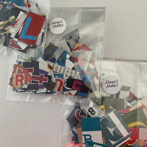 May include: Three clear plastic bags filled with colorful paper scraps. Each bag has a round sticker with the text "Maya's Makes" on it.