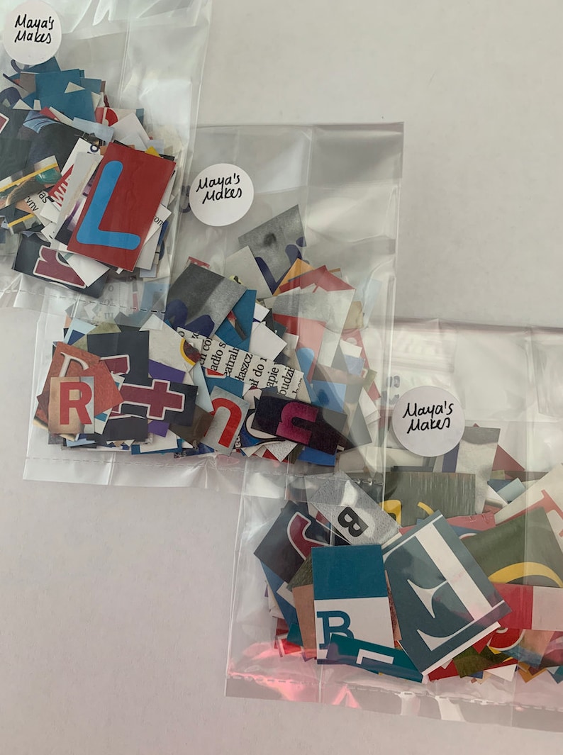 May include: Three clear plastic bags filled with colorful paper scraps. Each bag has a round sticker with the text "Maya's Makes" on it.