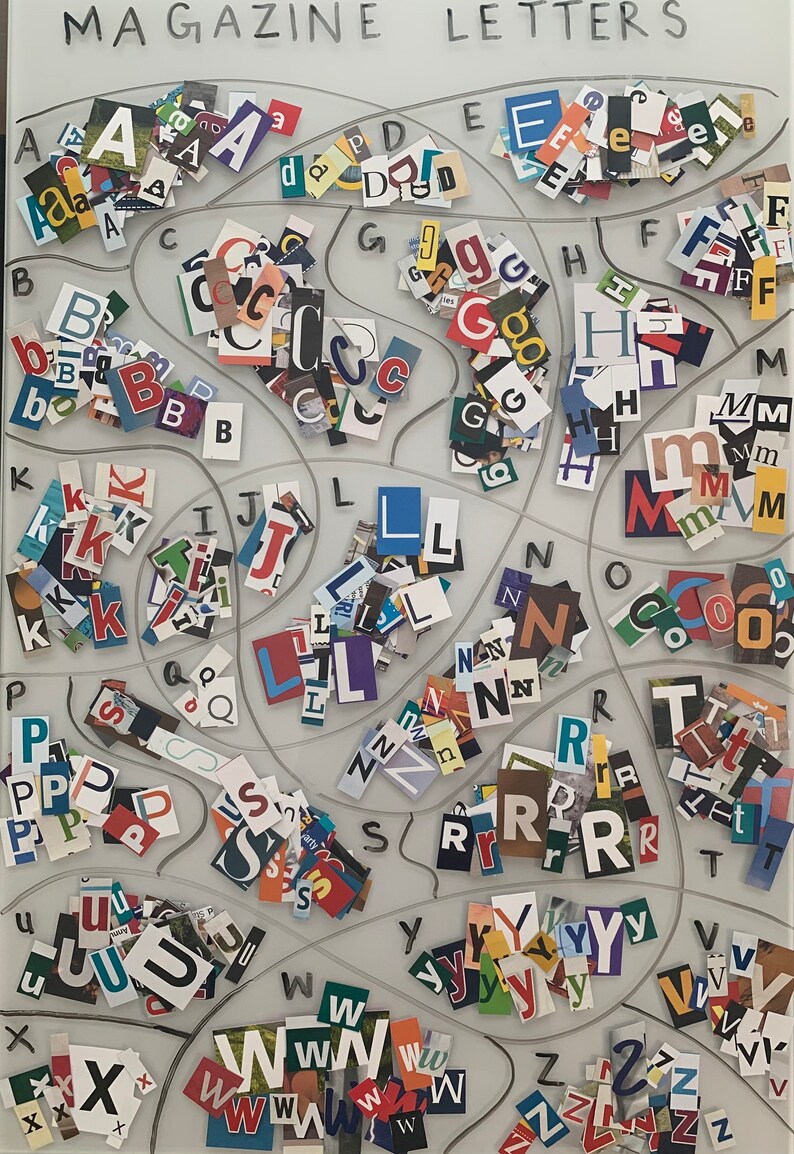 May include: A white board with the words "MAGAZINE LETTERS" written at the top. The board is divided into sections, each containing a different letter of the alphabet. The letters are made of cut-out magazine letters, creating a colorful and textured display.