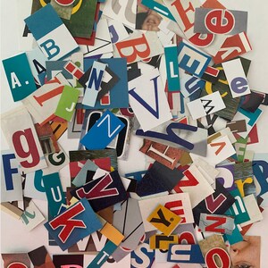 May include: A pile of colorful, cut-out letters from magazines, including the letters A, B, C, D, E, F, G, H, I, J, K, L, M, N, O, P, Q, R, S, T, U, V, W, X, Y, and Z.