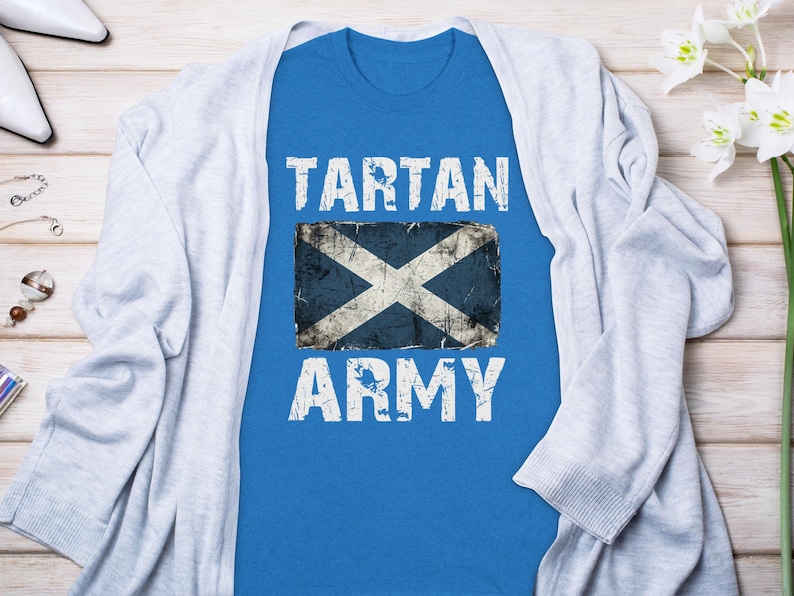 Blue t-shirt with distressed Scottish flag and "TARTAN ARMY" text.