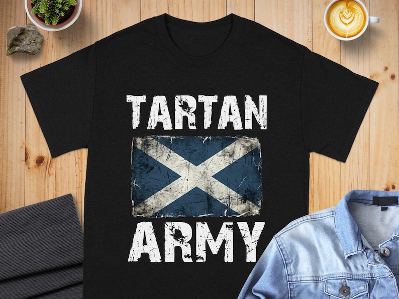 Black t-shirt with distressed Scottish flag and "TARTAN ARMY" text.