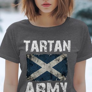 Dark grey t-shirt with distressed Scottish flag and "TARTAN ARMY" text.