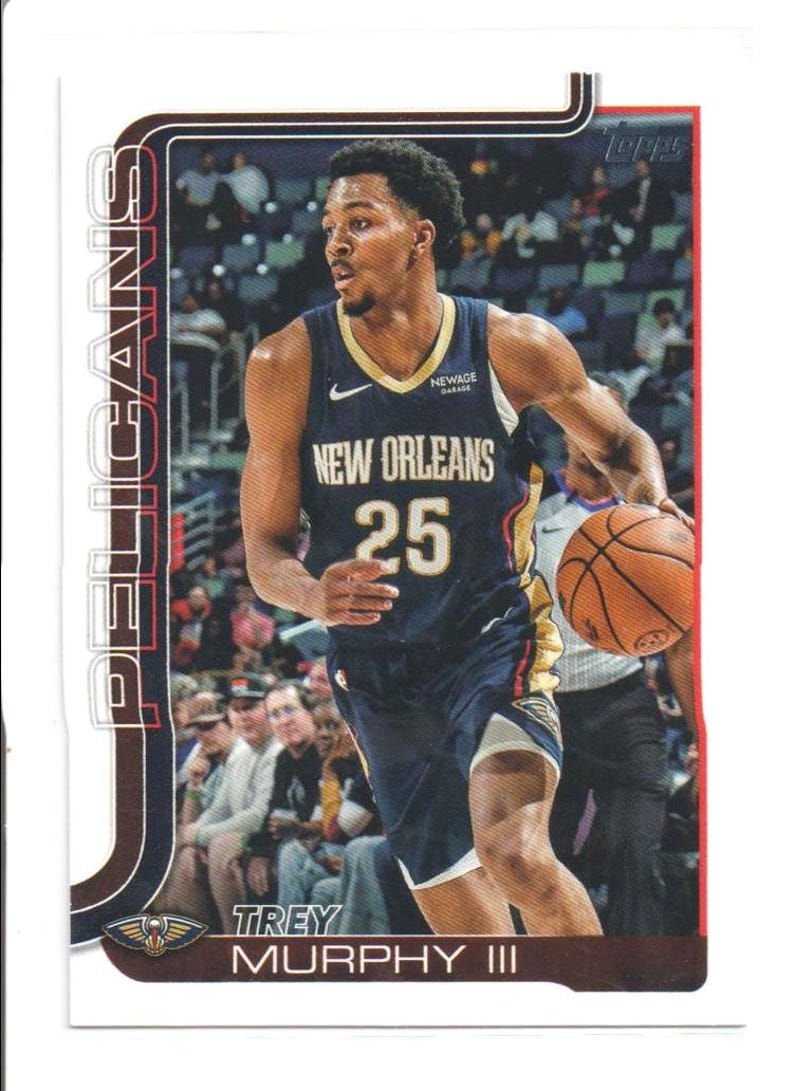 May include: A basketball trading card featuring Trey Murphy III of the New Orleans Pelicans. The card shows Murphy in a navy blue jersey with the number 25, dribbling a basketball. The card has the Pelicans logo and team name.