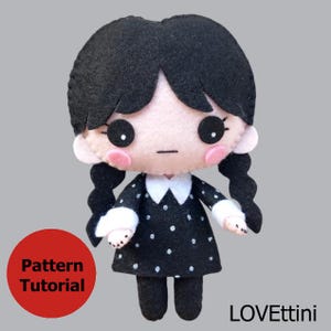 May include: A handmade felt doll of a character with black hair in pigtails, wearing a black dress with white polka dots and a white collar. The doll has a neutral expression, pink cheeks, and large black eyes. A red circle with the words "Pattern Tutorial" is in the lower left.