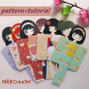May include: A selection of handmade paper bookmarks with anime-style girl faces and vibrant patterns. The bookmarks showcase diverse designs, such as cherries, cats, and floral motifs. The text "pattern+tutorial" and "NEKOttini" are displayed on the image.