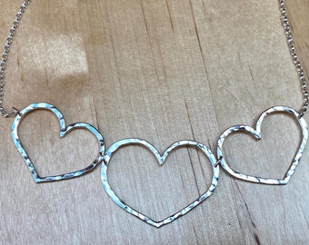 Three hearts necklace, handmade unique design, made from ethical recycled solid sterling silver, hammered finish