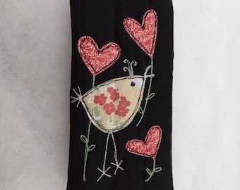 Handmade glasses case, black quilted cover, applique bird with three heart flowers