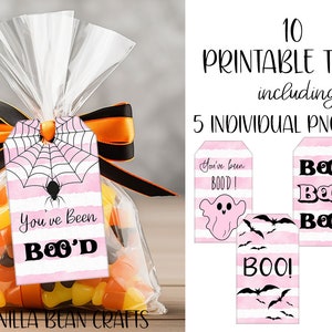 Puede incluir: Diez etiquetas de regalo de Halloween imprimibles con rayas rosas y blancas, que representan una telaraña, un fantasma, murciélagos y una calabaza. Las etiquetas dicen "You've Been Boo'd!" y "Boo!"