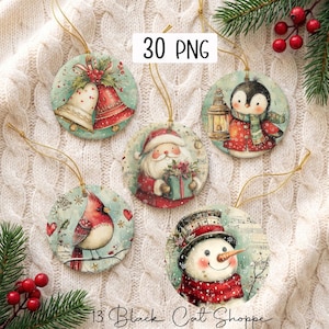 May include: Five round Christmas ornaments featuring watercolour illustrations of two bells, a penguin with a lantern, Santa Claus with a gift, a cardinal bird, and a snowman. Each ornament has a gold hanging string and a festive holiday design.