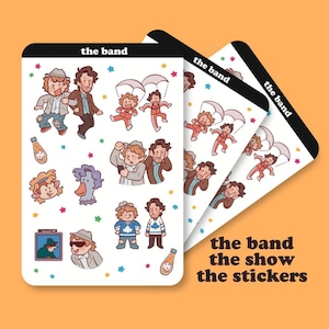 Op de afbeelding: Drie sticker vellen met cartoon illustraties van karakters en objecten. De stickers bevatten afbeeldingen van mensen, een eend en een fles. De tekst "the band the show the stickers" staat rechtsonder op de sticker vellen.