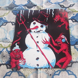 Demonios y muñecos de nieve de la década de 1980 Cuando el infierno se congela sobre cartón Arte de papel Halloween Navidad Mash Up Obra de arte Pesadilla navideña Diablo Nieve