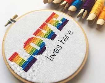 gay love lives here cross stitch pattern. lgbt rainbow pride art. queer wedding anniversary diy gift. lesbian, bisexual, pansexual, feminist