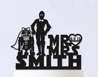 May include: Black silhouette cake topper featuring Star Wars characters R2-D2 and C-3PO with the text "Mr. & Mrs. Smith" and the date "9.9.19" in a heart.