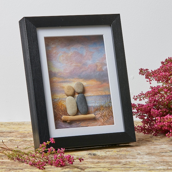 Couple sitting on the beach under colourful sky- unique pebble art gift