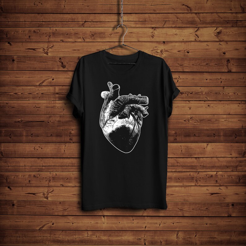 May include: Black t-shirt with a white anatomical heart graphic print.