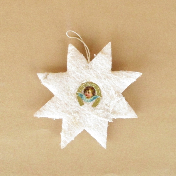 Antique spun cotton double Angel Face Star Christmas tree ornament. Christmas tree decoration. Visage d'ange étoile ornement d'arbre de Noël