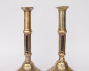 Antique 18th century push up pair of brass candle holders candlesticks