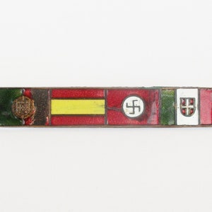 May include: A metal bar pin with enamel flags of Portugal, Spain, Germany, Italy, and Hungary. The flags are in red, yellow, green, white, and black.