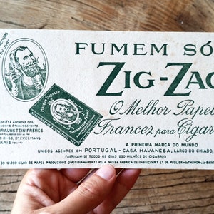 Hoja de cartón publicitaria de papel de liar en zig-zag antiguo poco común. Tabacciana. Hoja de cartón publicitario de papel en zig-zag