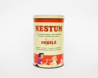 Rare vintage Nestum Nestle empty tin can. Great graphics and colors. Collectible. Boîte de céréales