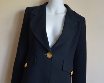 May include: A black blazer with gold buttons. The blazer has a single button closure and a notched collar.