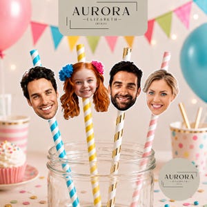 May include: Four decorative straws with smiling faces attached. The straws are striped in blue and white, yellow and white, and pink and white. The faces are of a man, a child, a man, and a woman. The image includes the text "AURORA -ELIZABETH- DESIGNS".