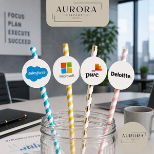 May include: A glass jar containing striped paper straws with company logos: Salesforce, Microsoft, PwC, and Deloitte. The straws are in blue/white, yellow/white, gold/white, and pink/white patterns. The image includes the text "AURORA -ELIZABETH- DESIGNS."
