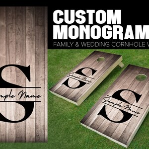 May include: Two wooden cornhole boards with a rustic wood grain design. Each board features a large black letter "S" with a black horizontal line and the text "Sample Name" written in cursive.  Custom Monogram Family & Wedding Cornhole Wraps.