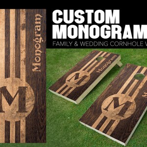 May include: Two wooden cornhole boards with a custom monogram design. The boards are stained brown with a light brown stripe down the center. The monogram is a large letter "M" in a circle. The text "Monogram" is printed on the side of each board. The text "CUSTOM MONOGRAM FAMILY & WEDDING CORNHOLE WRAPS" is printed at the top of the image.