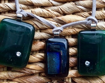 Unique handmade glass pendents on leather cord