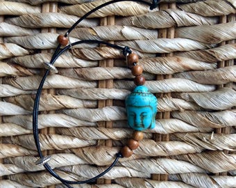 Unique handmade Buddha bracelet on leather cord