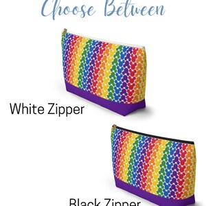 May include: Two rainbow-colored zippered pouches with a white Mickey Mouse pattern. The pouch on the top has a white zipper and the pouch on the bottom has a black zipper. Both pouches have a purple bottom.