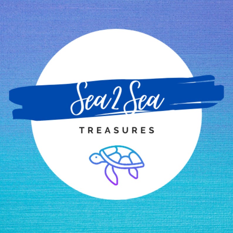 May include: A white circle with a blue brushstroke behind it. The text "Sea 2 Sea Treasures" is written in white cursive script. A blue and purple outline of a sea turtle is below the text.