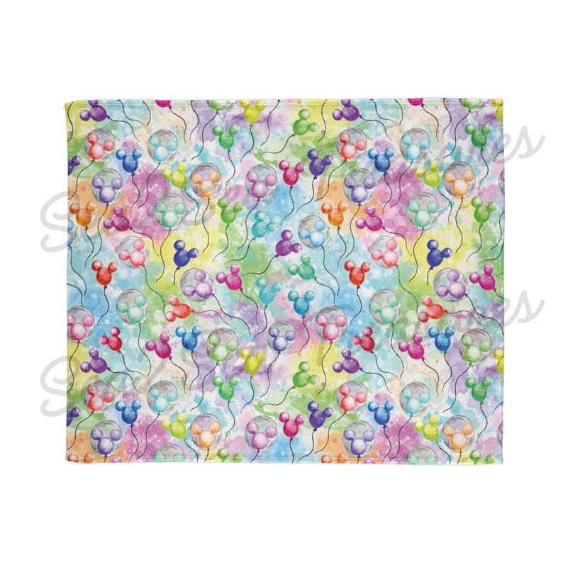 May include: A colorful fabric with a repeating pattern of Mickey Mouse shaped balloons in various colors against a watercolor background.