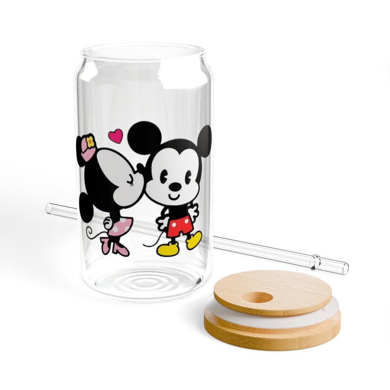 May include: A clear glass can with a straw and a bamboo lid. The can has a cartoon image of Mickey Mouse and Minnie Mouse kissing. The image is in black and white with red and pink accents.