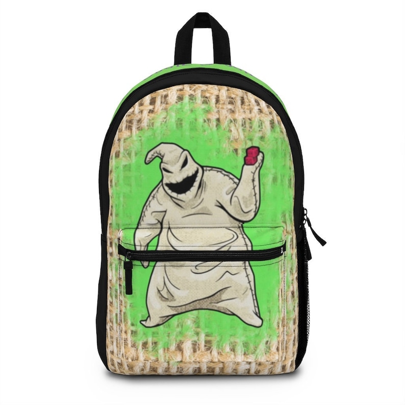 May include: A green and brown backpack with a burlap texture. The backpack features a cartoon image of a white ghost-like creature with a red heart in its hand.