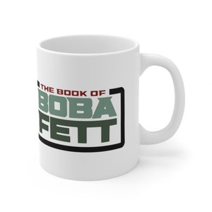 May include: White ceramic mug with a black and green graphic that says "The Book of Boba Fett".