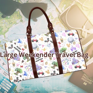 May include: A white travel bag with brown leather handles. The bag is covered in a pattern of colorful Disney characters and icons, including Mickey Mouse, Minnie Mouse, Cinderella's castle, and the words "Park Hopper".