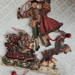 Vintage pull string wooden Victorian style skaters / horse and sleigh jumping jack ornaments, two