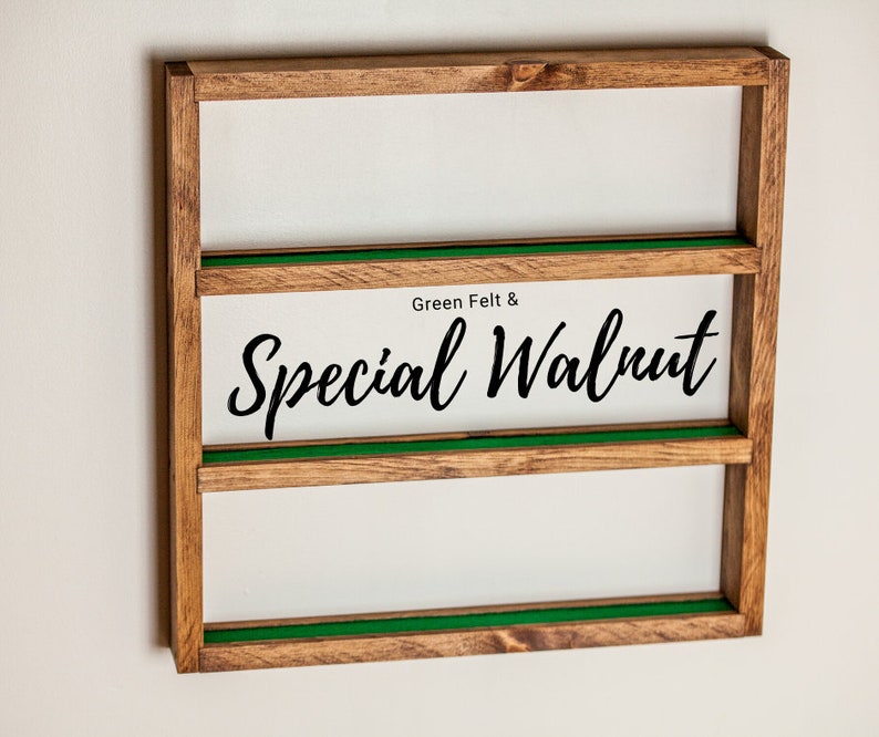 May include: A wooden wall shelf with three shelves. The shelves are lined with green felt. The shelf has the text "Green Felt & Special Walnut" printed on the front.