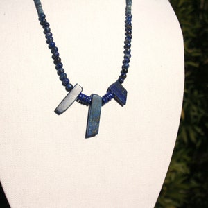 Lapis Lapis Lapis 3 different Lapis bead styles and a silver pearl finish to Sterling Clasp. 24 inches long.