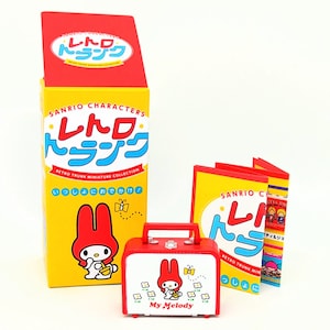May include: A red and yellow box with the text "Sanrio Characters Retro Trunk Miniature Collection" and an image of My Melody. The box is next to a set of four folded cards with the text "Sanrio Characters Retro Trunk Miniature Collection" and images of My Melody and other Sanrio characters.