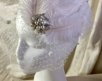 Wedding bridal bride headpiece with ostrich feather and pearl detail.Special formal , occasion wear , millinery,  hat , fascinator , white .