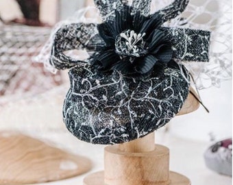 Dark Navy and white headpiece with waffle veiling