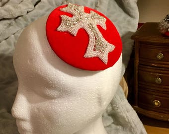 Red velvet fascinator for weddings , special occasions , New Year's Eve, horse racing or christmas.Striking diamanté and beaded cross design