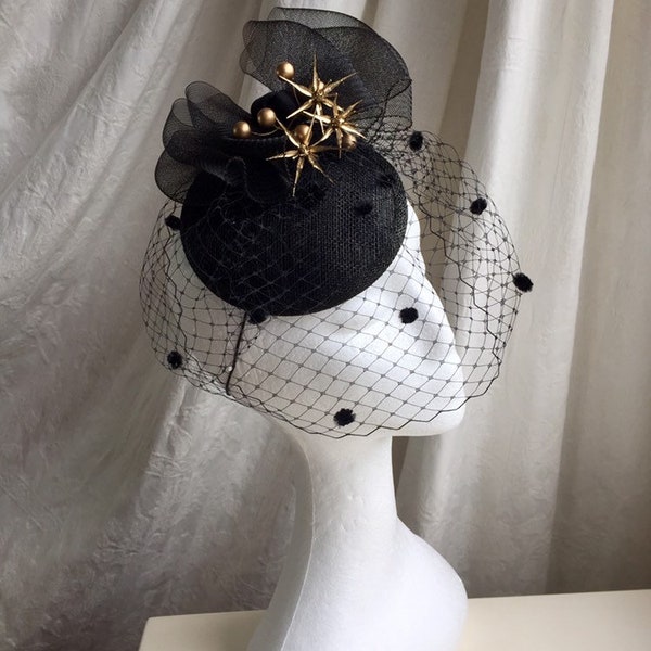 Black and gold hat , wedding, horse racing special occasion headpiece, tocado, with birdcage veil.