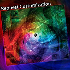 May include: A colorful playmat with a hexagonal pattern and the text "Request Customization." The design features a vibrant gradient of colors, with designated zones for game components. The Mad Hand Studio logo is visible.