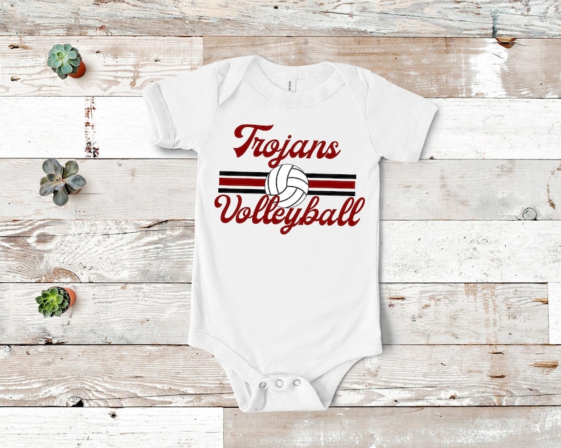a white bodysuit with a volleyball design on it