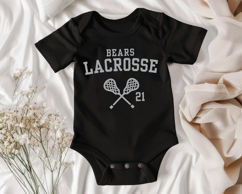a baby bodysuit that says bears lacrosse on it